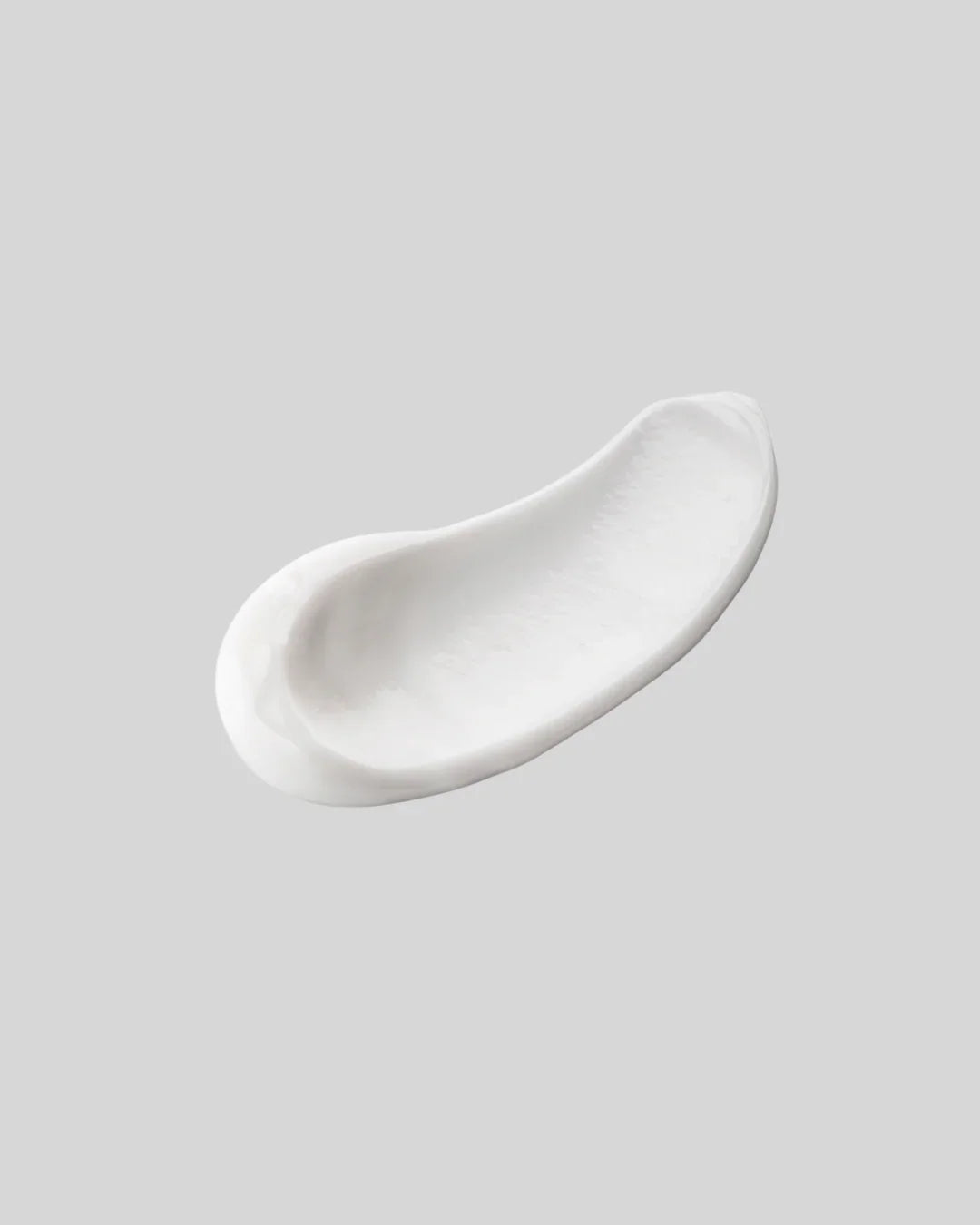 Swatch di crema viso idratante BuzzSkin su sfondo grigio, texture ricca skincare